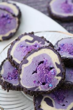 purple desserts are on a plate and ready to be eaten