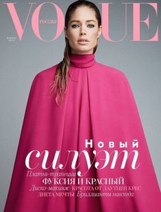 a woman in a red cape on the cover of a magazine