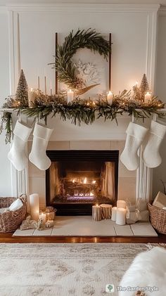 a fireplace decorated with stockings, candles and christmas wreaths for the mantelpiece