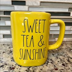 a yellow coffee mug with the words sweet tea and sunshine on it sitting on a counter