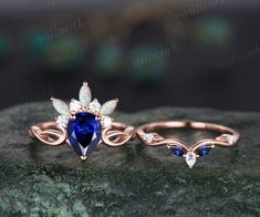 - Metal: Solid gold(10K/14K/18K white/yellow/rose gold),925 sterling silver,platinum available- Main Stone: 6x8mm pear lab blue sapphire- Accent Stone: round moissanites and marquise lab opals- Wedding Band Stone: lab sapphires and moissanites- Can be personalized: Yes Vintage Wedding Rings Sapphire, Sapphire Vintage Engagement Ring, Art Deco Rose, Ring Crown, Sapphire Engagement Ring Set, Blue Sapphire Engagement Ring, Vintage Engagement Rings Sapphire, Deco Rose, Gold Sapphire Ring