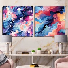 two paintings on the wall in a living room with pink chairs and a coffee table