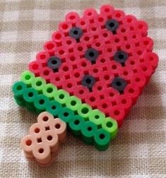 a piece of plastic bead sitting on top of a table