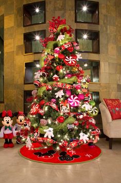 a christmas tree with mickey mouse decorations