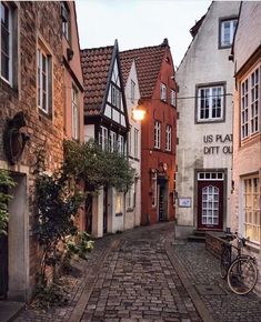 an old cobblestone street lined with buildings