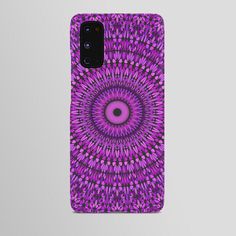 a purple phone case with an intricate design on the front and back cover, featuring a circular