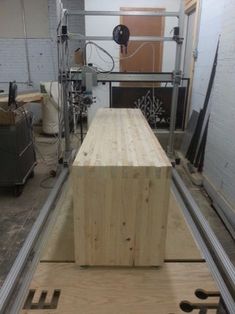 a large wooden box sitting in the middle of a room