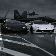 two sports cars parked next to each other in front of an airplane on the runway