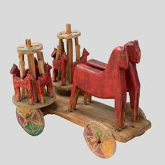 an old wooden toy horse and carriage