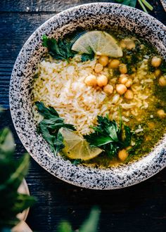 Green soup served with chickpeas and rice.