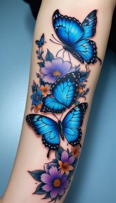 blue butterflies with purple flowers on the arm and wrist tattoo design for women, girls