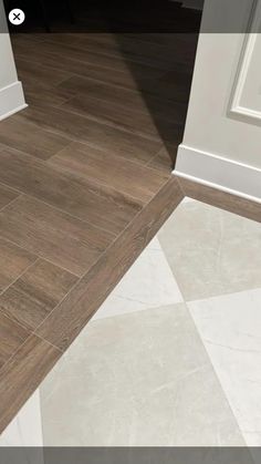 an image of a tile floor with white trim and wood grains on the edges