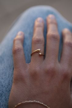 "Adjustable solid 14k yellow gold open ring. This solid gold ring has two gold teardrops - one on each side. The drops connect and bypass each other, and by so creating a gold ring in a unique teardrop shape. This ring will be made to your size - and can be worn on any finger. It can also be a great pinky ring. This ring is light and comfortable to wear and will be great for everyday use, as for fancy events.  I love wearing this ring especially on my pinky ring, but it will look great no matter Gold Ring Women, Minimalist Gold Ring, Unique Gold Rings, Stacked Rings, Signet Rings Women, Gold Pinky Ring, Gold Nose Stud, Gold Jewelry Gift, Modern Jewellery Design