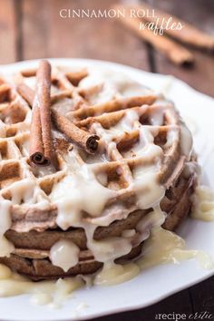 a waffle topped with cinnamon sticks and icing