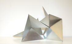 an origami sculpture sitting on top of a table