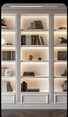 an image of a book shelf with many books on it's shelves in the living room