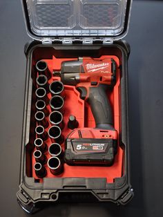 an open tool box with tools in it