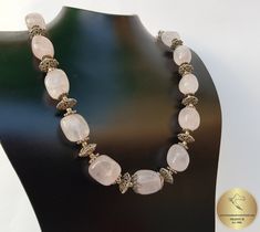 "◎ Necklace made from chunky beads of natural, rose quartz gemstone. Adorned with decorative filigree elements, everything is handmade from sterling 925 silver. ◎ Length: 46.8 cm ( 18.4\" ) Filigree cap diameter: 11 mm ( 0.43\" ) ◎ Enter the shop, for more of our jewelry, and matching earrings ;) ◎ - - - - - - - - - - - - - - - - - - - - - - - - - - - - - - - - - - - - - - - - - - - - - - - - - - Jewelry will be packed in a gift box and gift bag, and shipped in a padded envelope. - - - - - - - - Luxury Pink Rondelle Necklace, Pink Quartz Necklace, Pink Bead Necklace, Pink Stone Necklace, Pink Beaded Necklace, Beaded Rose, Large Bead Necklace, Stone Bead Jewelry, Beaded Necklace Designs