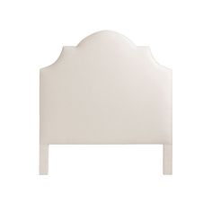 a white headboard with an arched design