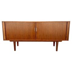 the sideboard is made out of wood and has two doors