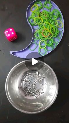 a bowl with noodles and two dices next to it