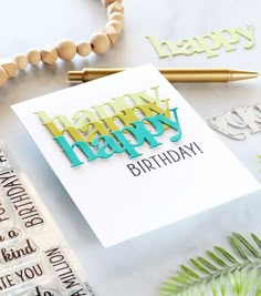 a happy birthday card sitting on top of a table