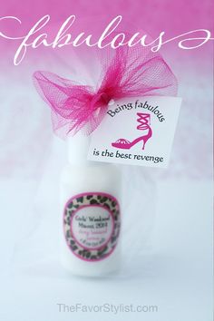 a bottle with a pink bow on it and the words girls'weekend written in white