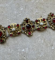 Circa 1800s Beautiful Austro Hungarian Garnet Pearl Gold Sterling Silver Victorian Art Nouveau Antique Bracelet Stunning, Highest of quality Measures 7 inches in length a little over 1 inch wide See  matching necklace in link below  https://www.etsy.com/listing/1682435990/victorian-art-nouveau-austro-hungarian?click_key=4aeb6d2f3fbad4f596876f572e4685baa536afbf%3A1682435990&click_sum=5615c927&ga_search_query=Austro&ref=shop_items_search_58&pro=1&frs=1&sts=1 Vintage Ceremonial Jewelry With Historical Design, Ceremonial Vintage Jewelry With Historical Design, Victorian Hallmarked Bracelets For Ceremonial Occasion, Vintage Baroque Jewelry With Historical Design, Victorian Ceremonial Bracelet With Intricate Design, Antique Red Bracelet For Formal Occasions, Red Antique Bracelet For Formal Occasions, Victorian Filigree Bracelets For Ceremonial Occasions, Hungarian Jewelry