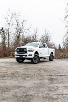 a white ram truck parked in a parking lot