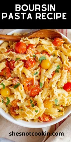 a white bowl filled with pasta and tomatoes