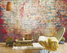 a living room with a brick wall in the background and a rug on the floor