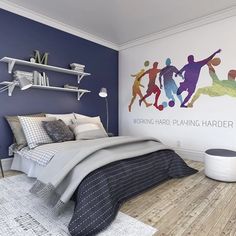 a bedroom with blue walls and wood flooring has a basketball mural on the wall