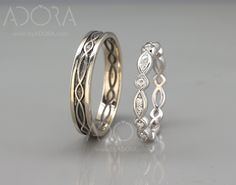 two wedding rings with diamond accents on each side and an intricate design in the middle