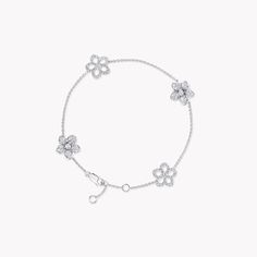 Four diamond flowers blossom upon our Wild Flower bracelet, unique down to every petal. Arranged with a wild touch, the two different styles of flower are exquisitely crafted to stand out, for an effect of both delicacy and strength. The Wild Flower collection is an invitation to escape into a garden that grows just for you. From trios and individual blooms to floral clusters and blossoms laid out in a row, each Wild Flower jewel is a statement of delicacy and of empowerment, designed to be worn Large Diamond Stud Earrings, Triple Diamond Ring, Large Diamond Rings, Rare Diamonds, Flower Diamond Ring, Pave Diamond Earrings, Diamond Bangles Bracelet, Platinum Jewelry, Heart Shaped Diamond