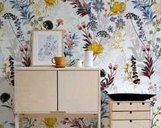 the wallpaper is very colorful and has flowers on it, as well as a potted plant