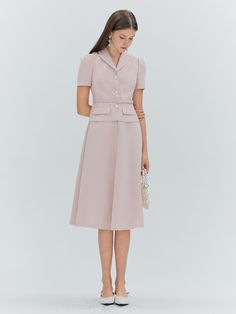 This product, the Erika Flare Dress, encapsulates a timeless elegance with a fitted bodice that flares into a graceful midi-length skirt. The addition of a matching belt enhances the dress's classic silhouette, drawing attention to the wearer's waist. It features a neatly tailored collar and a sleek button-down front, which add a touch of formality to the otherwise soft-flowing form. - This Erika Flare Dress includes a neatly tailored collar that frames the neckline beautifully.- The included belt cinches at the waist, providing a flattering shape and refined detail.- A button-down front offers a versatile closure that is both functional and stylish.- The dress's skirt flares gently from the waist, creating a silhouette that moves with grace and poise. Tailored A-line Midi Dress For Work, Chic Formal Midi Dress With Full Skirt, Classy Pastel Outfit, Fit And Flare A-line Midi Dress For Work, Elegant Full Skirt Midi Dress For Work, Elegant Midi Dress With Full Skirt For Work, Feminine Fitted Tea Length Dress For Formal Occasions, Classic A-line Midi Dress With Pleated Waist, Chic Midi Dress With Flared Skirt For Work