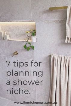 a bathroom with towels hanging on the wall and a towel rack in front of it that says 7 tips for planning a shower niche