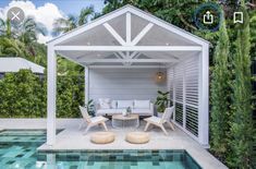 an outdoor living area next to a swimming pool