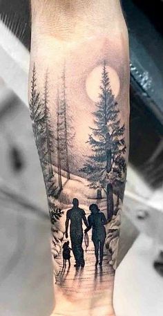 a man's arm with an image of two people and a dog on it