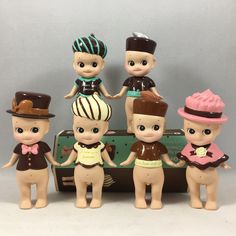 a group of little figurines that are standing next to each other