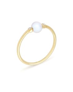 The Cathleen 14k Yellow Gold Band Ring in Pearl is stunningly simple, and a staple piece for any wardrobe. This 14k Yellow Gold band ring features one of our pearls on an understated setting with two petite diamonds that complete the look. The Cathleen 14k Yellow Gold Band Ring is a piece that will live happily in your collection forever. 

Our diamonds are conflict-free in compliance with the Kimberley Process. Elegant Everyday Moonstone Ring, 14k Gold Pearl Ring With Single Diamond, Elegant Everyday Pearl Ring With Round Band, Elegant Everyday Moonstone Ring With Round Band, Elegant Everyday Pearl Ring With Pearl Drop, Minimalist 14k Yellow Gold Pearl Ring, Elegant Everyday Pearl Drop Ring, Minimalist Akoya Pearl Ring, Pearl Images