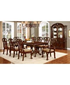 a dining room table with chairs and a china cabinet