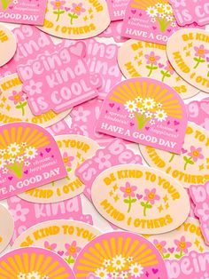 pink and yellow stickers with flowers on them are in the shape of sunbursts