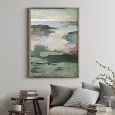 a painting hanging on the wall above a couch