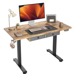 a computer desk with a monitor, keyboard and mouse on it in front of a white background