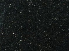 the sky is filled with lots of stars and black stuff on it's surface