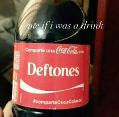 someone holding up a coca cola bottle with the caption deftones