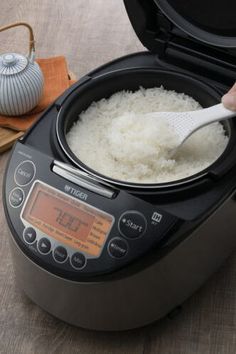 rice being cooked in an automatic rice cooker