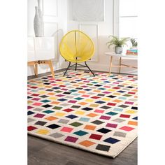 a multicolored area rug with a yellow chair