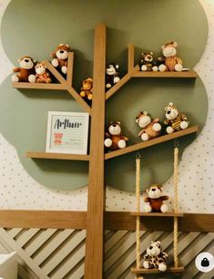 there are many stuffed animals on the shelves in this children's playroom with ladders